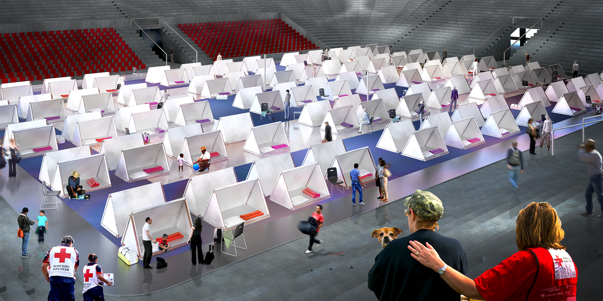 Sleeping modules laid out across a sports hall converted into a temporary shelter